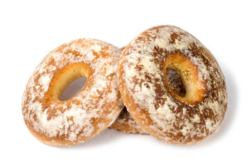 A pile of gingerbread with a hole on a white background. Close-up of confectionery.