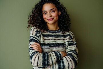 Obraz premium a woman with curly hair wearing a striped sweater