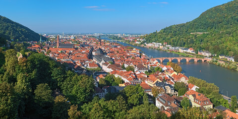 Heidelberg, Germany. High angle view over the Heidelberg Old Town with Jesuit Church, Church of the Holy Spirit and Old Bridge (Karl Theodor Bridge) across the Neckar river. - 702092207