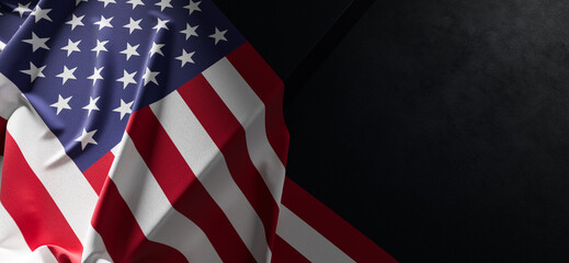 Flag of United States of America. Fabric textured United States of America flag isolated on dark background. 3D illustration