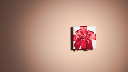 white gift box Orange background, red ribbon. Free space to post messages, advertisements, happy hour concept.