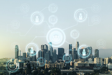 Double exposure of abstract virtual social network icons on Los Angeles city skyscrapers background. Marketing and promotion concept