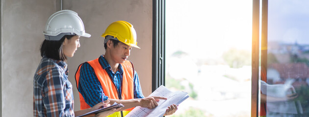 Client and Contractor discussing plan to renovation house.
