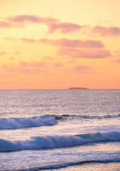 Fototapeta na wymiar sunset on the beach with wave 
