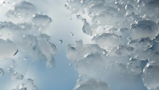 A magnified of a frozen lake surface with small air bubbles ped within the ice, demonstrating the phase transition between liquid water and solid ice.