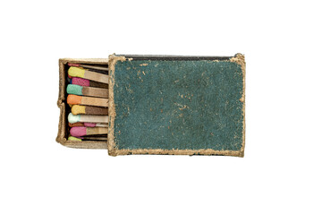 old matchbox with many colored matches on white background