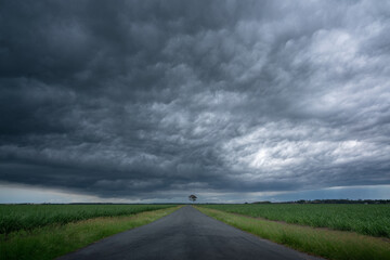 Fototapeta na wymiar storm clouds over the road