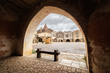 Place des Cornieres, the market square in the 13th century bastide of Monpazier in the Dordogne...