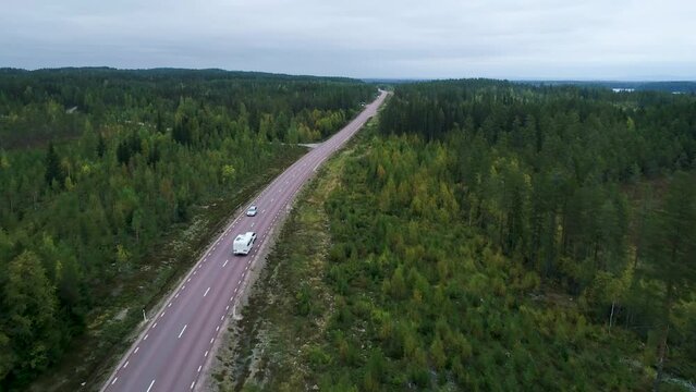 Caravan Camping driving on E45 Higway Road through the wilderness of middle Sweden between the towns of Malung and Oje