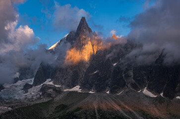 Last rays of sun on the sheer cliffs of Aiguilles des Drus in the Mont Blanc mountain range....