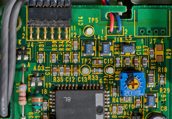 Detail of old electronic components of a motherboard with its chips, capacitors and solders