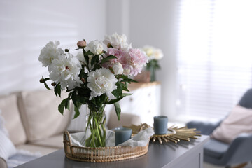Bouquet of beautiful peony flowers on table indoors. Space for text