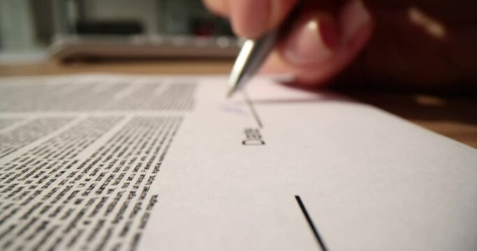 Closeup of letter signature and business agreement