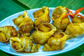 Steamed Spotted Babylon Blanching (Fresh Sea Babylonia Areolata Shell Boiled) served with passion...