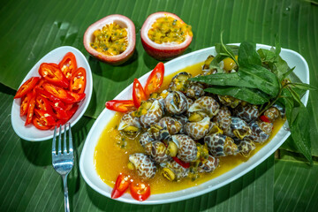 Steamed Spotted Babylon Blanching (Fresh Sea Babylonia Areolata Shell Boiled) served with passion...