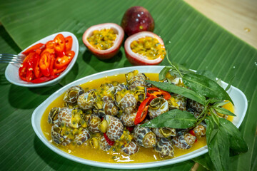Steamed Spotted Babylon Blanching (Fresh Sea Babylonia Areolata Shell Boiled) served with passion...