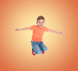 Obraz premium Happy boy jumping on color gradient background