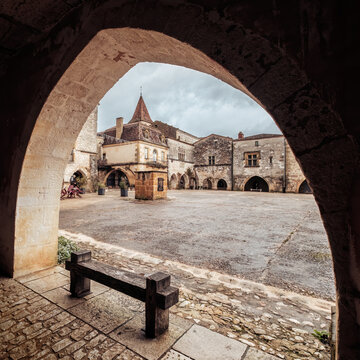 Place des Cornieres, the market square in the 13th century bastide of Monpazier in the Dordogne region of France
