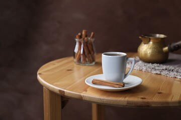 Turkish coffee. Freshly brewed beverage on wooden table