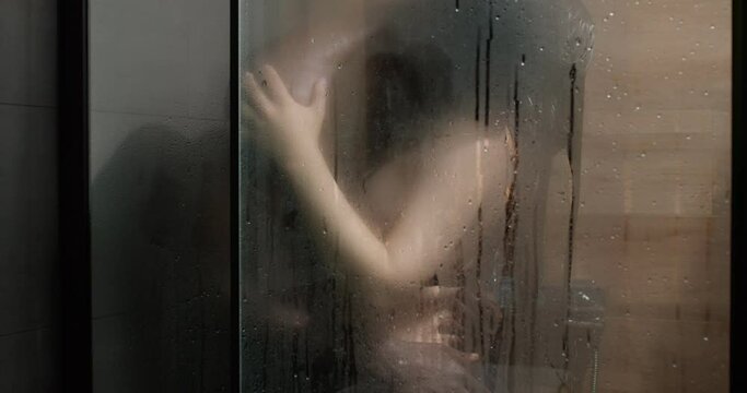interracial couple in love kissing. Handsome black man and caucasian woman enjoying shower together. Tender moments concept. Sexy couple. Young sexy woman abd Hot guy. Sexual concept. Copy Space