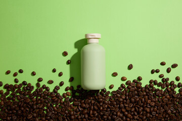 On a green background, a cosmetic bottle container for cream or lotion decorated with may coffee...