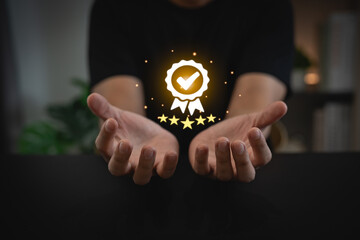 Man hand holding virtual icon providing a five-star premium service. hand man showing award high...