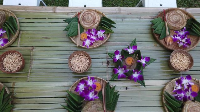 Krathong, the handcrafted floating candle made of floating part decorated with green leaves colorful flowers and many sorts of creative materials for festival Loy Krathong in Thailand