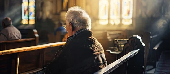 Fotobehang Gospel prayer or old woman in church for God holy spirit or catholic religion in cathedral or Christian community Faith worship bow or elderly person in chapel or sanctuary to praise Jesus Chri © vxnaghiyev