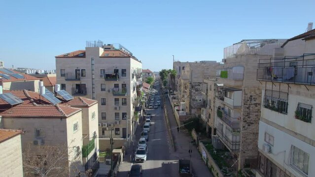 Mea Shearim Orthodox Jewish neighborhood day time, Jerusalem, Israel - one of the oldest Jewish neighborhoods, push in drone shot