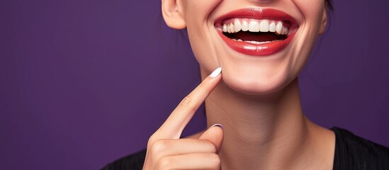 dental health beauty hygiene and people concept close up of smiling woman face pointing to teeth...