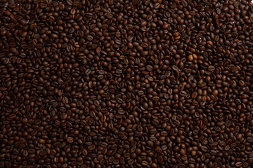 Close-up of roasted coffee beans. Scene of the drink advertisement helps to keep the spirit awake. Coffee is a beloved beverage known for its ability to fine-tune your focus and boost energy level