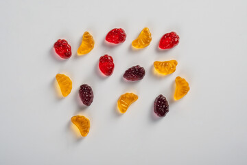 Assorted gummy candies, Juicy colorful jelly sweets. Gummy candies on white background