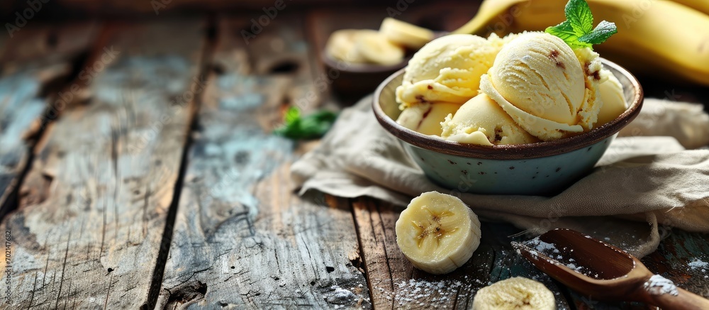 Leinwandbilder banana ice cream in bowl on country table. with copy space image. place for adding text or design