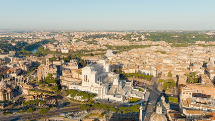 Fototapeta na wymiar Rome, Italy. Vittoriano - Monument to the first king of Italy, Victor Emmanuel II. Flight over the city. Panorama of the city in the morning. Summer, Aerial View