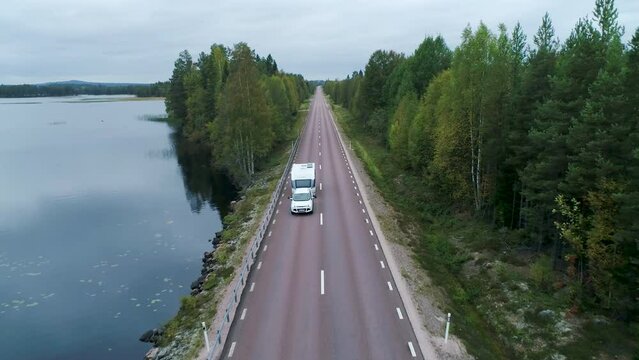 Caravan Camping driving on E45 Higway Road through the wilderness of middle Sweden between the towns of Malung and Oje