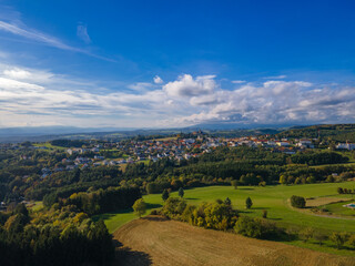 Fall colors in Austrian Burgenland. Beautiful village aerial view. Landscape with beautiful clouds and buildings. Countryside.