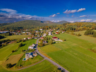 Fall colors in Austrian Burgenland. Beautiful village aerial view. Landscape with beautiful clouds and buildings. Countryside.