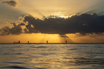 Paddle boarding during sunset