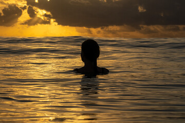 Girl Silhouette inside the ocean