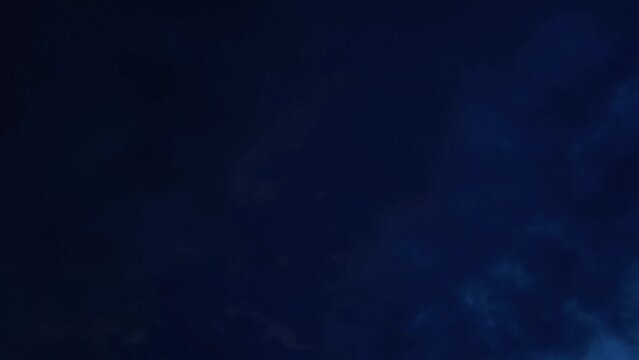 Red cloud lightens and changes to a bluish color at dawn