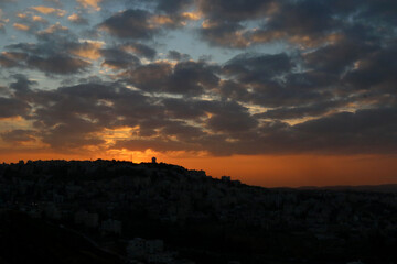 Sunset over the mountains west of the capital