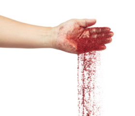 Red metallic glitter sparkle fall from hand. Red Glitter sand spark blink celebrate Chinese new year, particle pour from hand. White background isolated, selective focus Blur bokeh