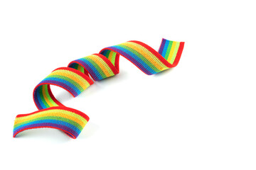 Colorful rainbow ribbon closeup isolated on white background. Colorful LGBT design. Curly, fluttering ribbon.