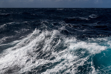 Beautiful seascape - waves and sky with clouds with beautiful lighting. Stormy sea, Bad weather. Gale. Rough sea. Beaufort scale 6.