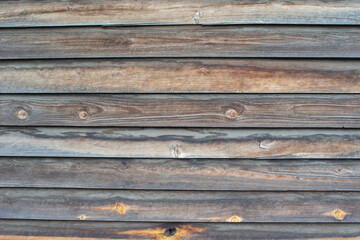 Classic background of wooden planks of uneven gray color.