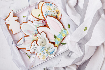 Gift box with Easter decorated glazed cookies. Spring cozy aesthetic table.