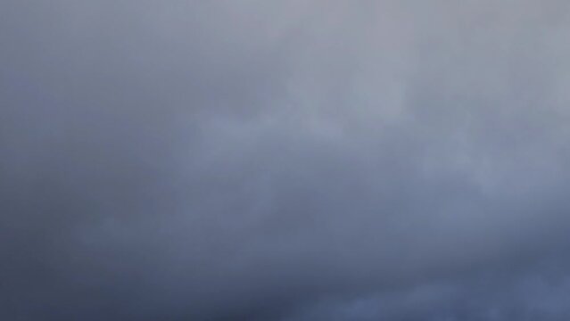 Very strange sky with a golden stratocumulus cloud that changes to an anil color