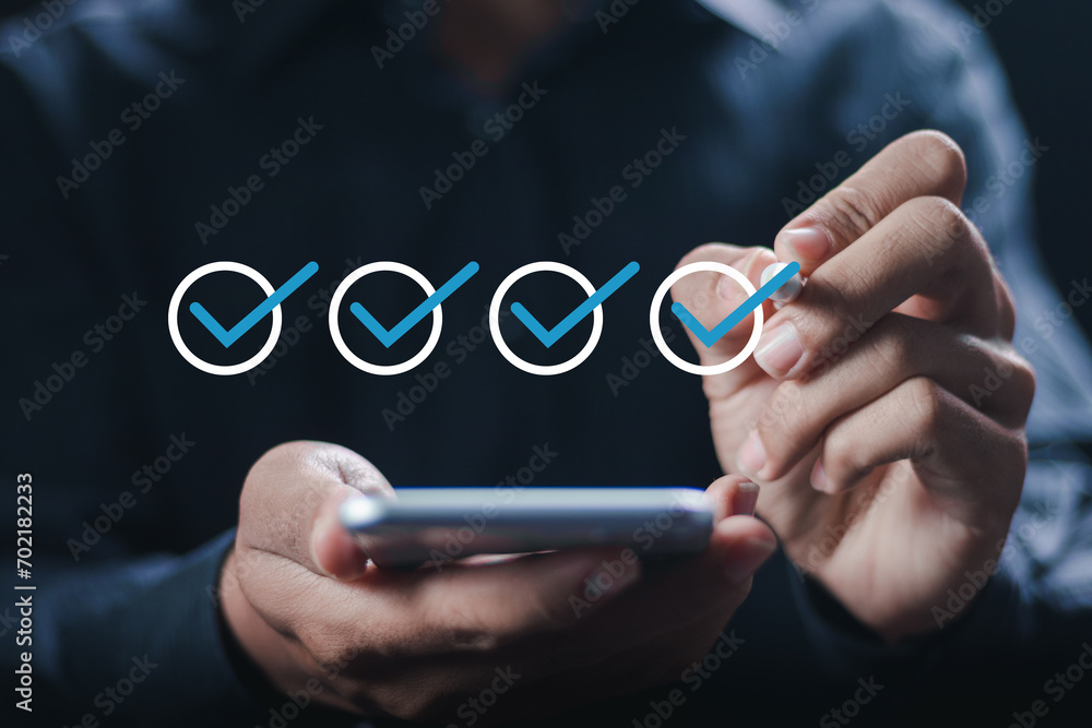 Poster business project approval concept. businessman use smartphone with making correct sign mark on check