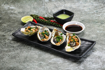 Open half oysters with green onion