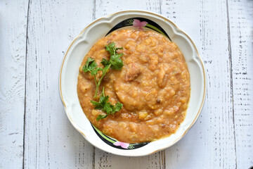 Pea porridge in a plate on the table.